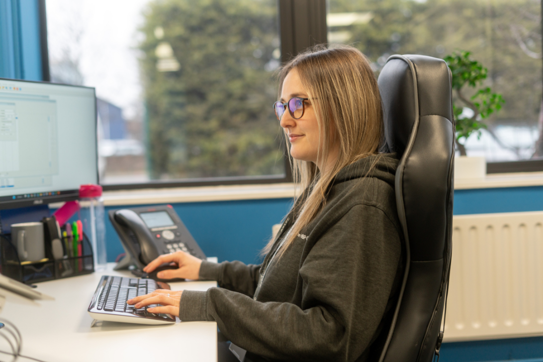 Woman sat at computer desk