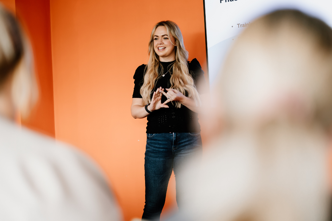 Woman stood presenting