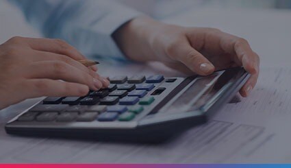 Accounting Software Engineer Using Calculator