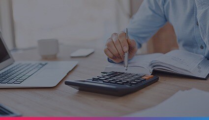 Accounting expert using calculator