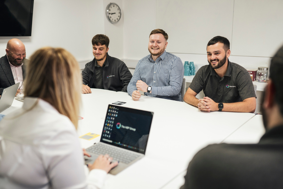 Employees sat around white table