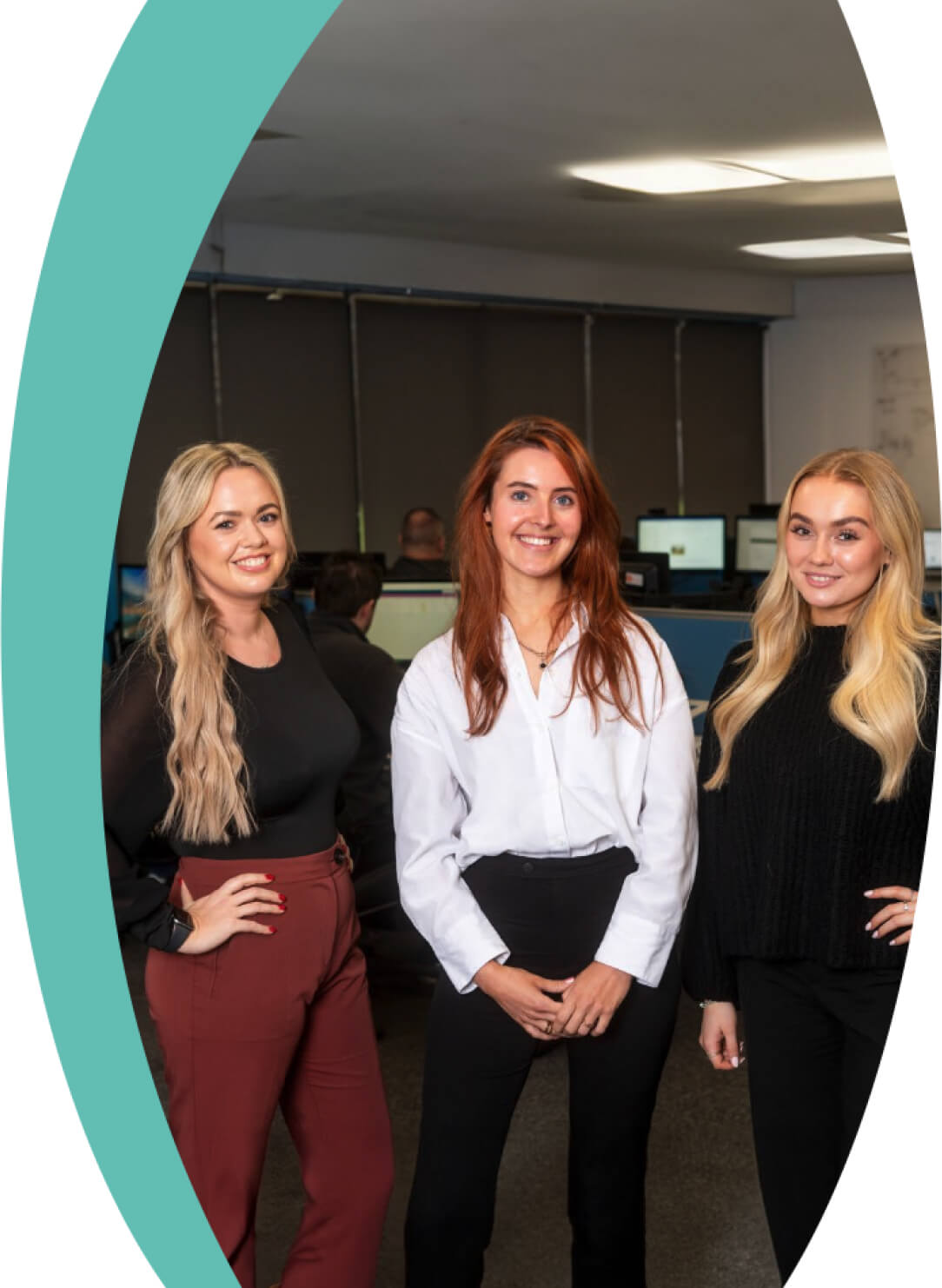 3 Women smiling in an office setting