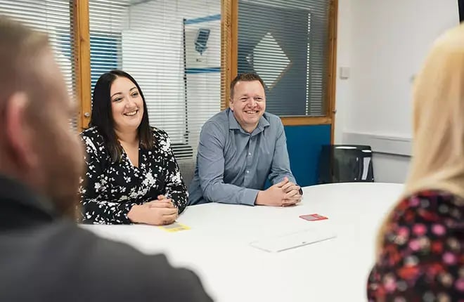 IT-Strategy-Review-Consultancy-Two-People-Smiling-in-Meeting-Room